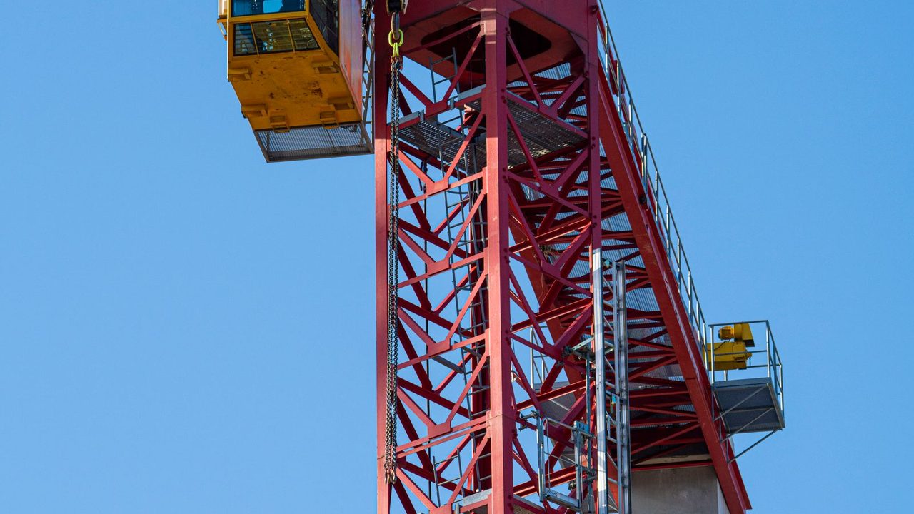 Construction crane against an open sky.